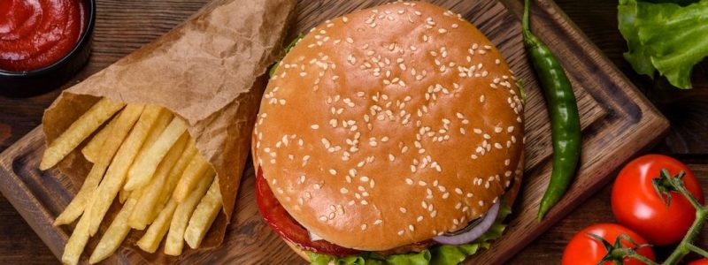 craft-beef-burger-and-french-fries-on-a-black-background-e1664111539632.jpg